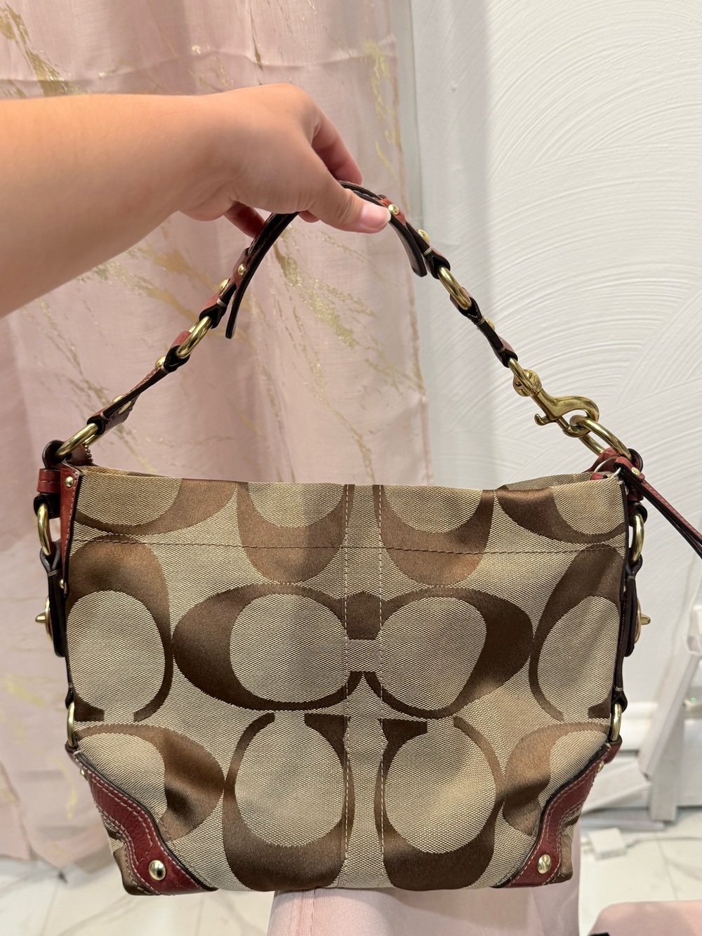 Coach Carly medium in Signature Pattern Brown Canvas with burgundy accents